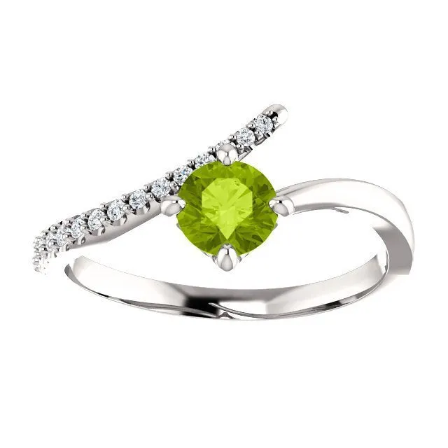 14KT GOLD 0.55 CT PERIDOT & 0.10 CTW DIAMOND ACCENT BYPASS RING