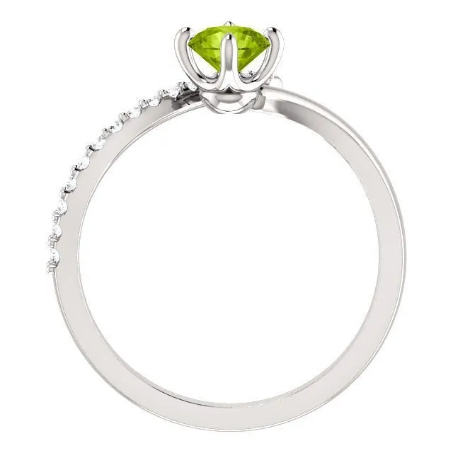 14KT GOLD 0.55 CT PERIDOT & 0.10 CTW DIAMOND ACCENT BYPASS RING