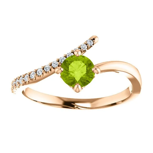 14KT GOLD 0.55 CT PERIDOT & 0.10 CTW DIAMOND ACCENT BYPASS RING