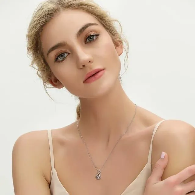 Silver necklace with dancing diamond necklace and moissanite