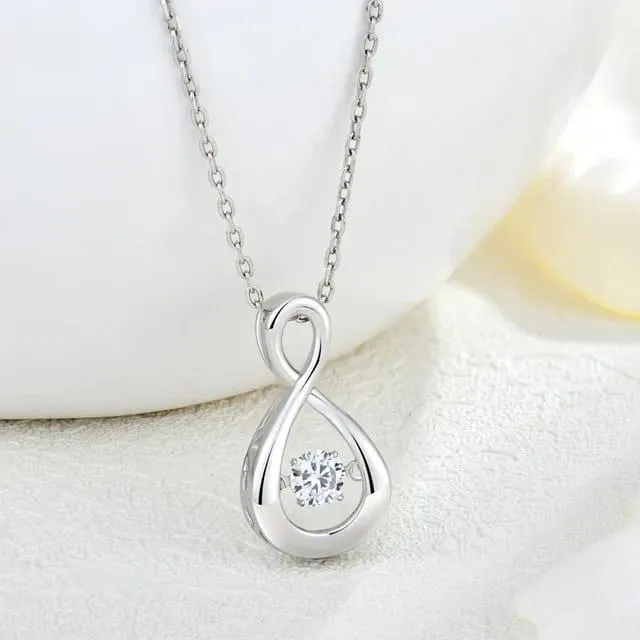 Silver necklace with dancing diamond necklace and moissanite