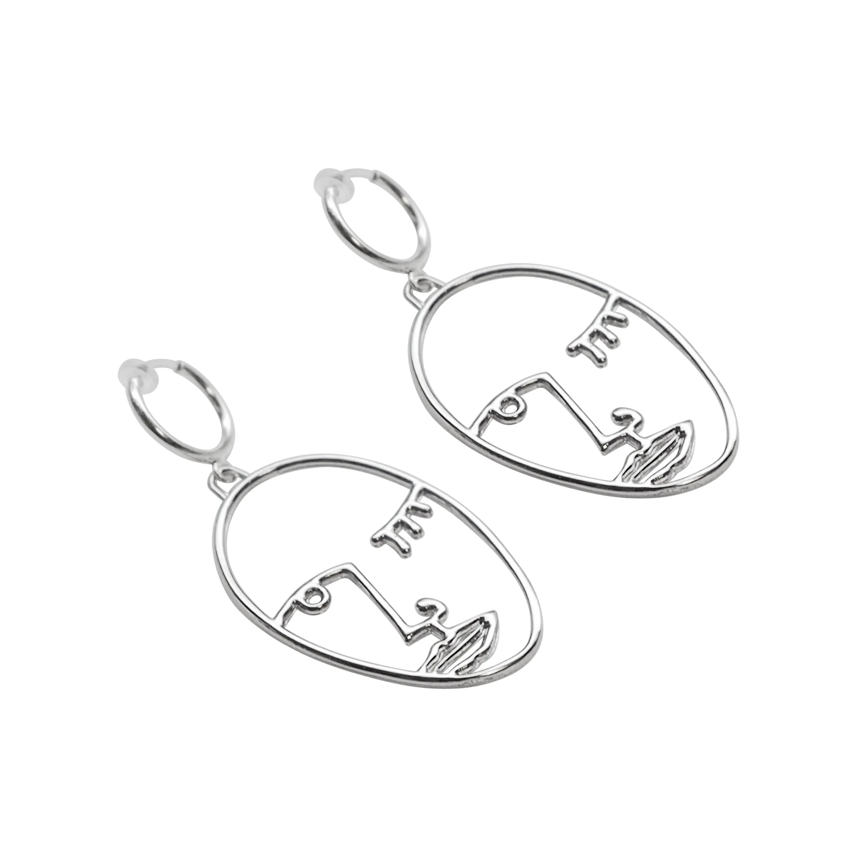 Silver Picasso human face clip on hoop earrings